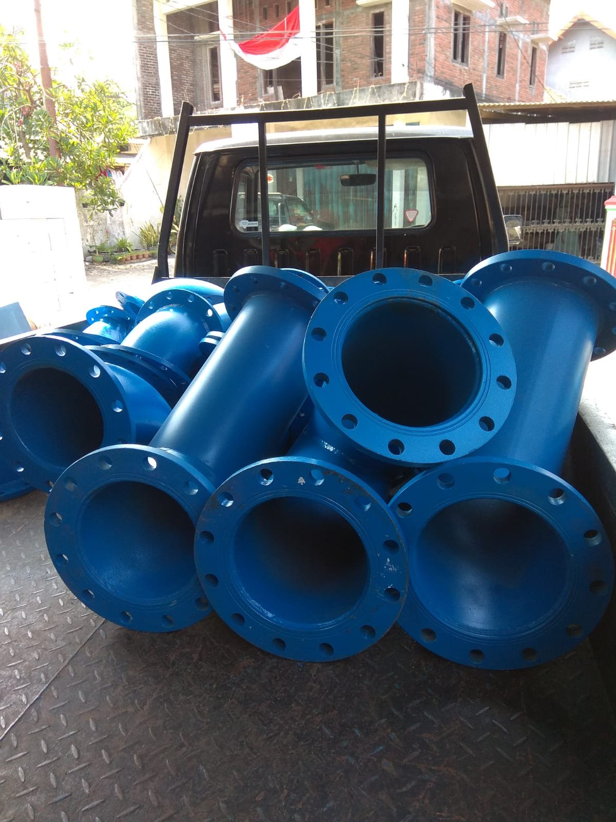 Blue flanged piping accessories manufactured for industrial water systems