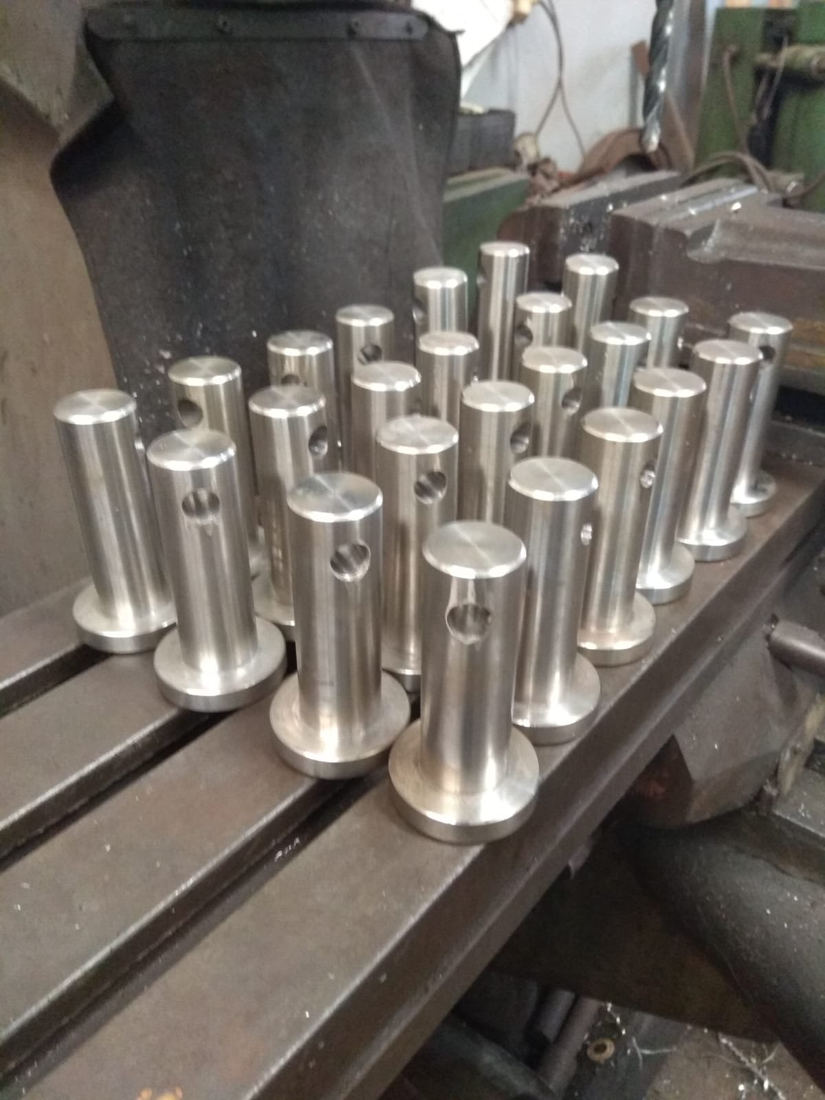 Precision-machined tube connectors with cross-drilled ports